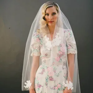raw cut fingertip length tulle veil with lace appliques