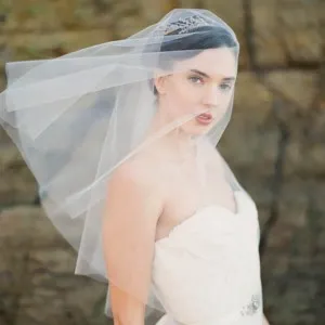one tier ivory tulle elbow length short veil over face