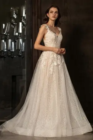 sequinned blush underneath ivory flower lace wedding gown