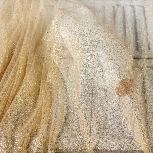 sparkly gold faded ombre glitters glued metallic fabric