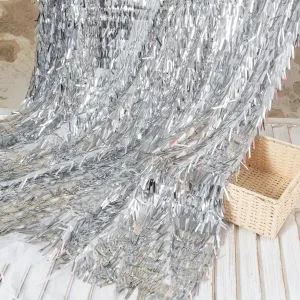 dazzling silver sword shaped sequins on white mesh fabric