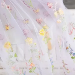 ethereal lilac mesh base with pastel floral embroidery