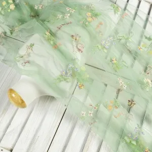mint green floral butterfly embroidery dressmaking fabric