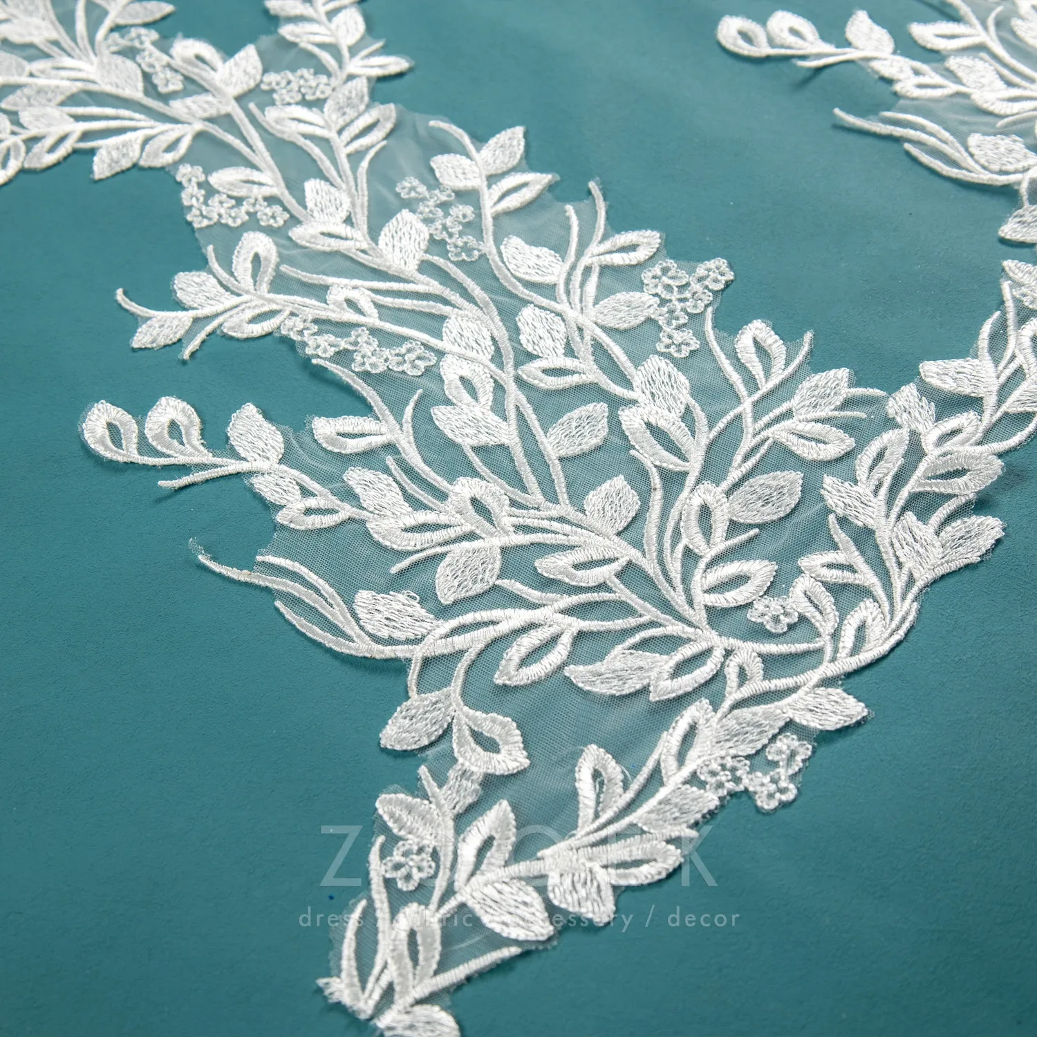 a piece of large size leaf pattern embroidered lace applique