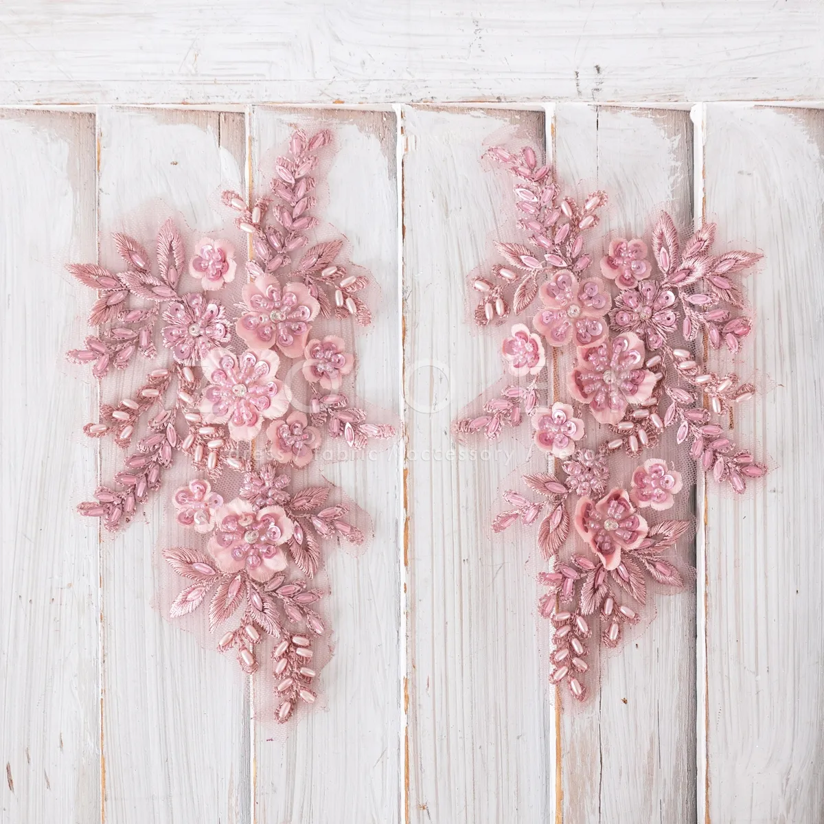 pair of elegant pink beaded lace motifs for dressmaking