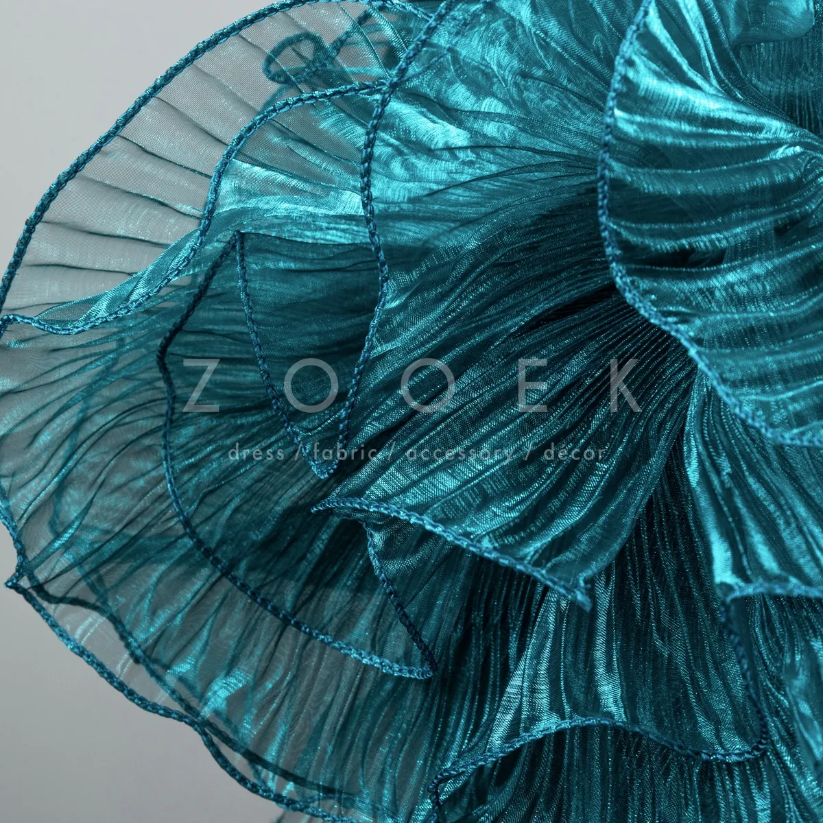shimmering peacock blue pleated organza trim